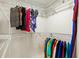 Bright walk-in closet with ample shelving and hanging space for organized storage at 632 Valencia Rd, Venice, FL 34285