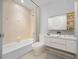 Elegant bathroom features vanity mirror, soaking tub, and modern finishes at 718 Golden Beach Blvd # 2, Venice, FL 34285
