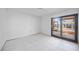 Bedroom features natural light, tile flooring, and sliding doors to the outside at 718 Golden Beach Blvd # 2, Venice, FL 34285