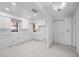 Bright kitchen space with white cabinets, tile flooring, and natural light, ready for customization at 718 Golden Beach Blvd # 2, Venice, FL 34285