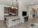 Kitchen island with breakfast bar seating and open view into the kitchen area at 830 The Esplanade N # 201, Venice, FL 34285