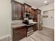 Well-equipped kitchen with stainless steel appliances, granite countertops, and ample storage space at 830 The Esplanade N # 201, Venice, FL 34285