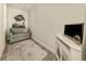 Cozy living room with a comfortable chair, stylish rug, and entertainment area at 830 The Esplanade N # 201, Venice, FL 34285