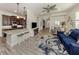 Open-concept living space with a breakfast bar connecting to a gourmet kitchen and ample seating at 830 The Esplanade N # 201, Venice, FL 34285