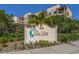 An inviting sign with lush foliage welcomes visitors to the Che Vista Venice Beach Condominium complex at 830 The Esplanade N # 201, Venice, FL 34285