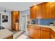 Kitchen featuring wood cabinetry, granite countertops, and access to the outdoors at 832 Saintclair Cir # 832, Venice, FL 34285