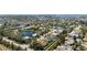Extensive aerial view of a neighborhood near waterways featuring a mixture of home styles and sizes at 8603 46Th Avenue W Cir, Bradenton, FL 34210