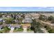 Aerial view of the home, demonstrating a community near the water and a sandy construction area at 8603 46Th Avenue W Cir, Bradenton, FL 34210