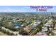 Beautiful aerial view of a residential community with waterfront homes and easy access to the beach, just 3 miles away at 8603 46Th Avenue W Cir, Bradenton, FL 34210