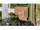 Aerial view of the property showing the brown roof, lawn, surrounding landscaping and neighborhood streets at 8603 46Th Avenue W Cir, Bradenton, FL 34210