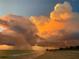 Scenic beach view featuring dramatic sunset clouds and a tranquil shoreline at 8603 46Th Avenue W Cir, Bradenton, FL 34210