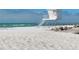Idyllic beach scene with lifeguard station, offering a safe and enjoyable coastal experience for all at 8603 46Th Avenue W Cir, Bradenton, FL 34210