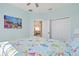 Bright bedroom with a decorative sea life theme, featuring a view into the living room and closet at 8603 46Th Avenue W Cir, Bradenton, FL 34210
