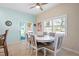Dining area with tiled floors, bright lighting, and sliding glass door access to the outdoor area at 8603 46Th Avenue W Cir, Bradenton, FL 34210