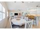 Open floor plan featuring a dining area with seating for six and views into the living room and kitchen at 8603 46Th Avenue W Cir, Bradenton, FL 34210