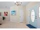 Inviting foyer with tile flooring and attractive front door at 8603 46Th Avenue W Cir, Bradenton, FL 34210