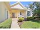 Welcoming front porch features seating and manicured landscaping at 8603 46Th Avenue W Cir, Bradenton, FL 34210
