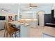 Open-concept kitchen with a breakfast bar and stainless steel appliances at 8603 46Th Avenue W Cir, Bradenton, FL 34210