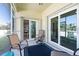 Relaxing lanai area with comfortable seating and sliding glass doors to inside and screened windows to the outside at 8603 46Th Avenue W Cir, Bradenton, FL 34210