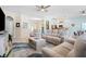 Spacious open-plan living room with comfortable seating and a ceiling fan at 8603 46Th Avenue W Cir, Bradenton, FL 34210