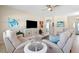 Comfortable living room featuring neutral paint, tile floors, and modern decor at 8603 46Th Avenue W Cir, Bradenton, FL 34210