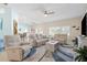 Bright and airy living room featuring neutral paint, tile floors and a ceiling fan at 8603 46Th Avenue W Cir, Bradenton, FL 34210