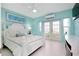 Bedroom with white furnishings, light blue walls, and a view to the outside at 9061 Kellogg Ln, Venice, FL 34293