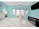 Bedroom featuring white furnishings, fireplace, and a view to the outside at 9061 Kellogg Ln, Venice, FL 34293