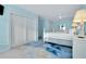 Bright bedroom featuring a white bed frame, closet and access to the living room at 9061 Kellogg Ln, Venice, FL 34293