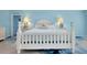 Charming bedroom with white furniture, beach-themed decor, and soft lighting creating a relaxing atmosphere at 9061 Kellogg Ln, Venice, FL 34293