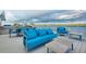 Deck area featuring lounge seating, dining, and an outdoor grill at 9061 Kellogg Ln, Venice, FL 34293