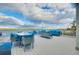 Wide plank deck with a dining table and multiple seating areas offering beautiful views at 9061 Kellogg Ln, Venice, FL 34293