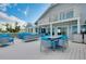 Exterior view from a deck with outdoor dining and seating areas with water views at 9061 Kellogg Ln, Venice, FL 34293