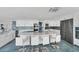 Bright, spacious kitchen boasts a large marble island, stainless appliances and lots of storage at 9061 Kellogg Ln, Venice, FL 34293