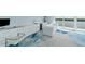 Bright office space with built in cabinets, sleek tile floors, and views of the water at 9061 Kellogg Ln, Venice, FL 34293