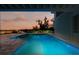 Backyard pool with lush landscaping at 9061 Kellogg Ln, Venice, FL 34293