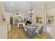 Open concept breakfast nook area with stainless steel appliances, granite countertops and view to the dining area at 9407 Prospect Ave, Englewood, FL 34224