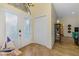 Inviting foyer with tile flooring and view into living areas and bedroom hallway at 9407 Prospect Ave, Englewood, FL 34224