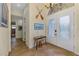 Bright foyer featuring tiled floor, high ceilings, and decorative furnishings at 9407 Prospect Ave, Englewood, FL 34224