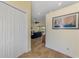 Inviting hallway with tile floors and artwork, leading to the main living area at 9407 Prospect Ave, Englewood, FL 34224