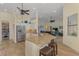 Open concept kitchen with stainless steel appliances, granite countertops, and view to the living room at 9407 Prospect Ave, Englewood, FL 34224