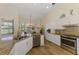 Open kitchen with stainless steel appliances, granite countertops and connected breakfast nook at 9407 Prospect Ave, Englewood, FL 34224