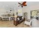 Open living space connects to a kitchen with barstool seating and an adjacent office at 9407 Prospect Ave, Englewood, FL 34224