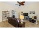 Comfortable living area featuring tile flooring, ceiling fan and transom window lighting at 9407 Prospect Ave, Englewood, FL 34224