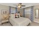 Serene bedroom showcases soft natural light and tasteful decorations at 410 Mission E Trl # H, Venice, FL 34285