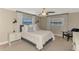 Relaxing bedroom featuring soft natural light, a ceiling fan, and tasteful decorations at 410 Mission E Trl # H, Venice, FL 34285