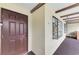 Inviting front entrance with a unique display window and a neutral color scheme for a warm welcome at 410 Mission E Trl # H, Venice, FL 34285