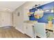 Comfortable entrance area featuring a desk space, a mirror, and decor at 410 Mission E Trl # H, Venice, FL 34285