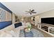 Inviting living room boasts a comfortable sectional sofa, stylish decor, and an open floor plan at 410 Mission E Trl # H, Venice, FL 34285