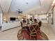 Open-concept living space with a view of the kitchen, dining area, and main living room at 2198 Chenille Ct, Venice, FL 34292